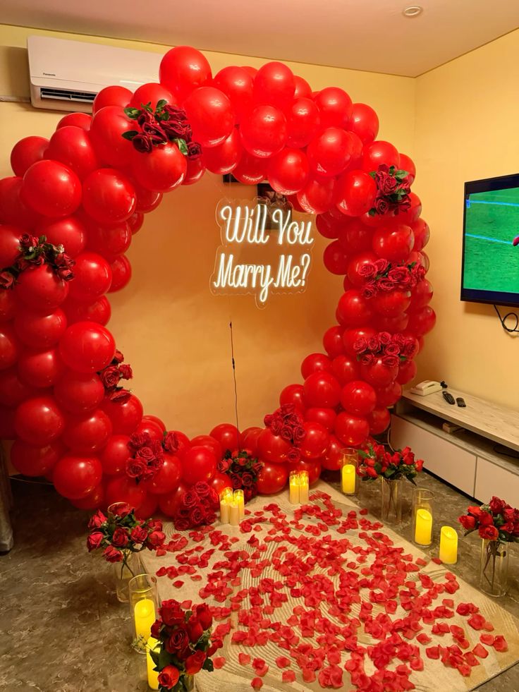 Red Ring Balloon Arch with Roses & Neon Sign