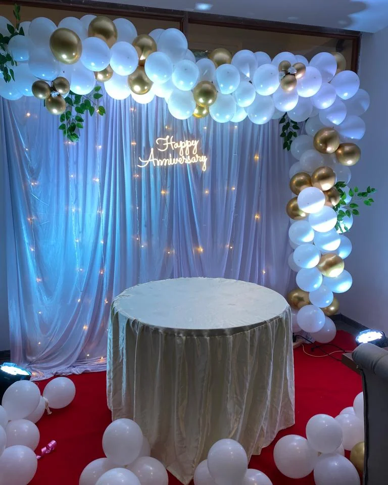White & Gold Drape Arch with Happy Anniversary Neon