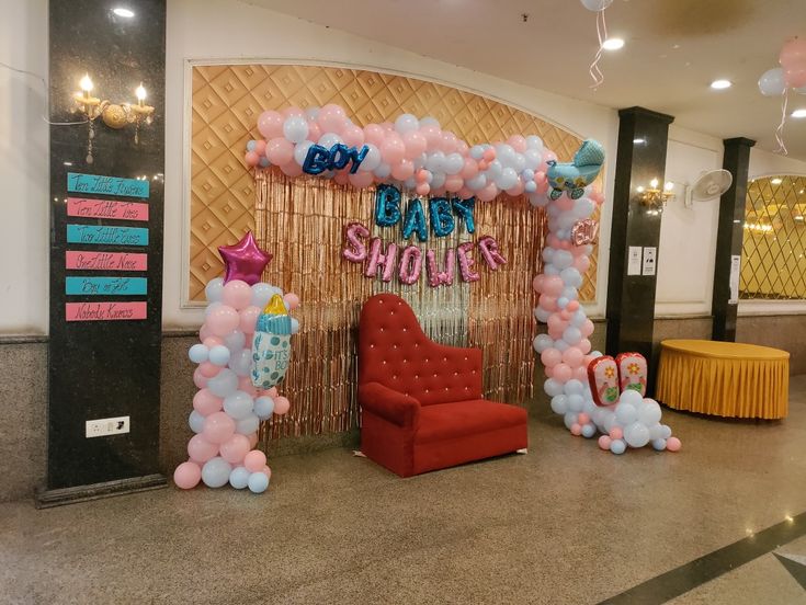 Rose Gold Curtain 'Baby Shower' Foil Arch with Red Couch