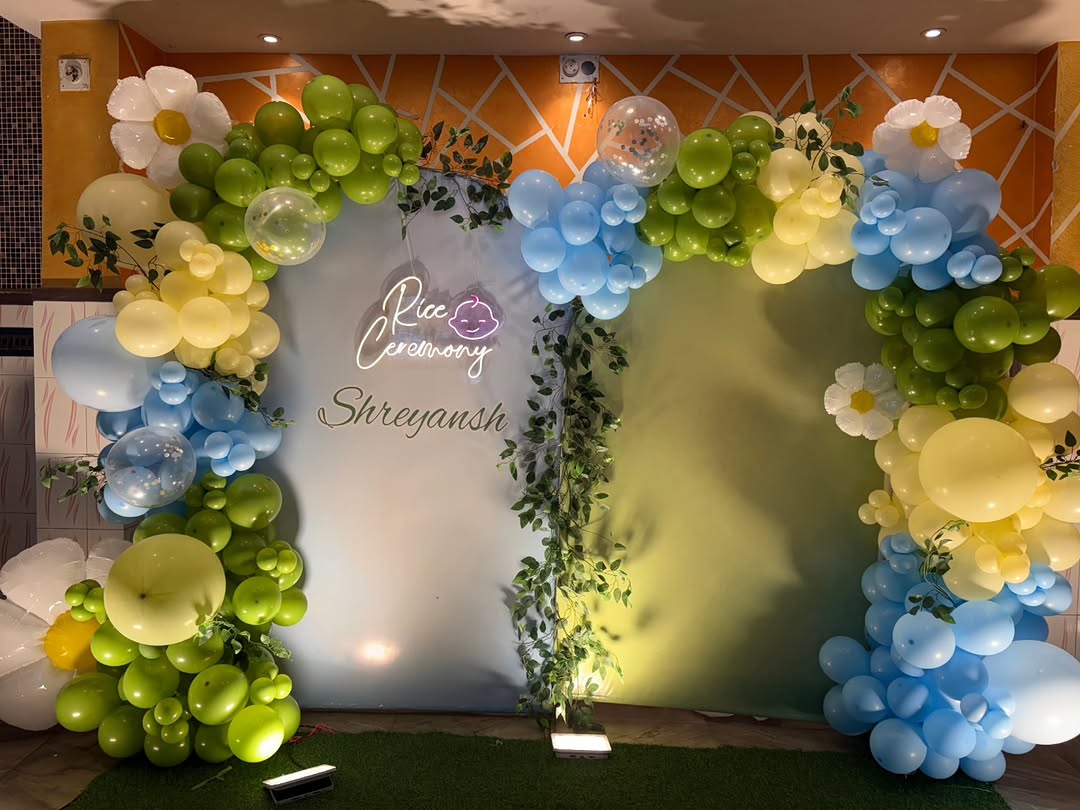 'Shreyansh Rice Ceremony' Green, Yellow & Blue Daisy Arch
