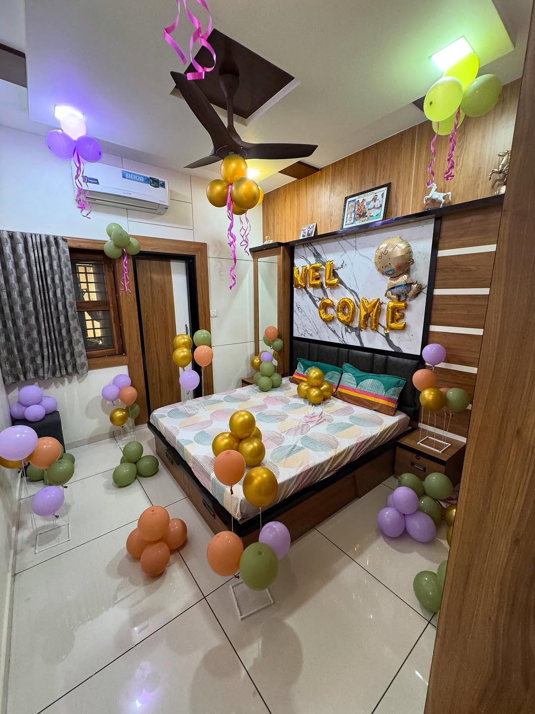 Gold 'Welcome' Bedroom Setup with Pastel Balloon Bouquets