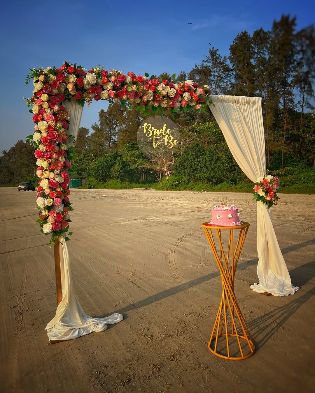 Beach Floral Arch with 'Bride To Be' Neon & Cake Table